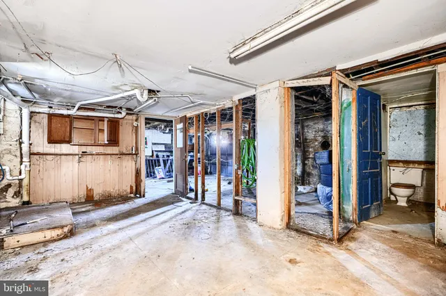 a bathroom with a toilet sink and shower