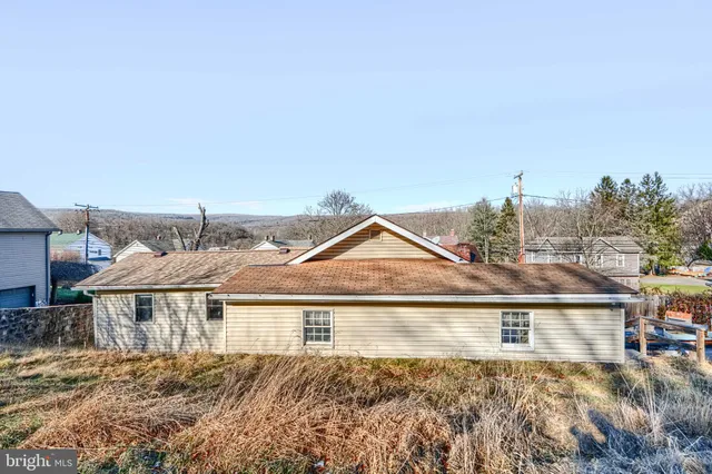 a backyard of a house with lots of green space