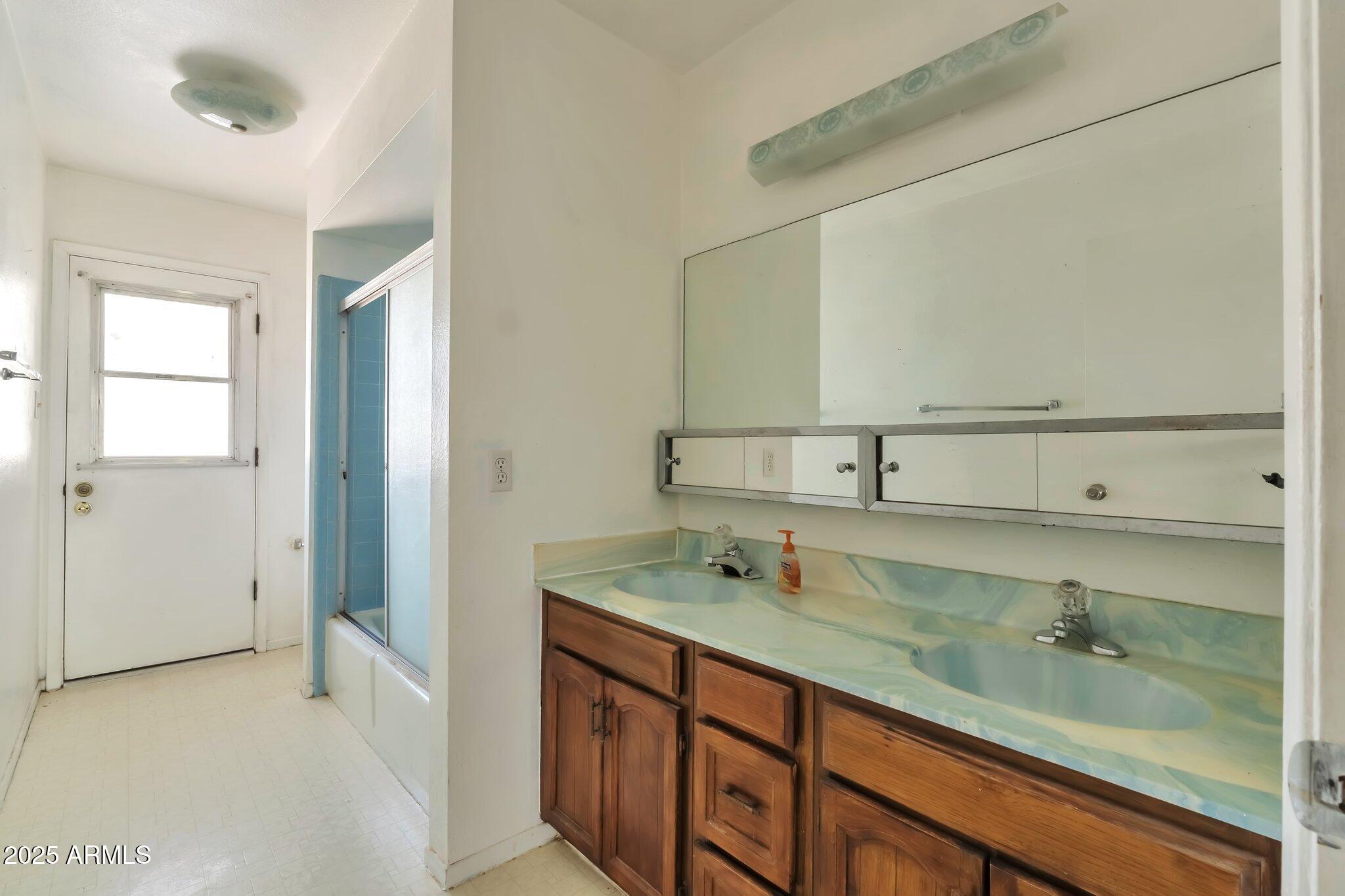 504 North Emerson Mesa, AZ 85201 - Photo 12 of 19 a bathroom with a sink and a mirror