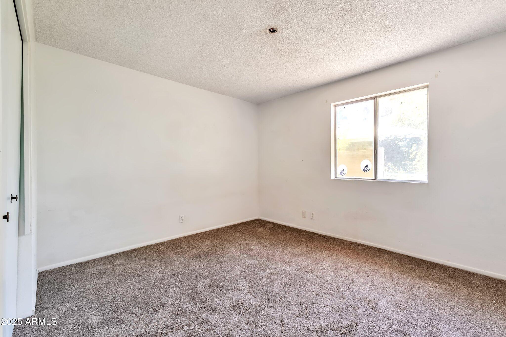 504 North Emerson Mesa, AZ 85201 - Photo 13 of 19 an empty room with a window