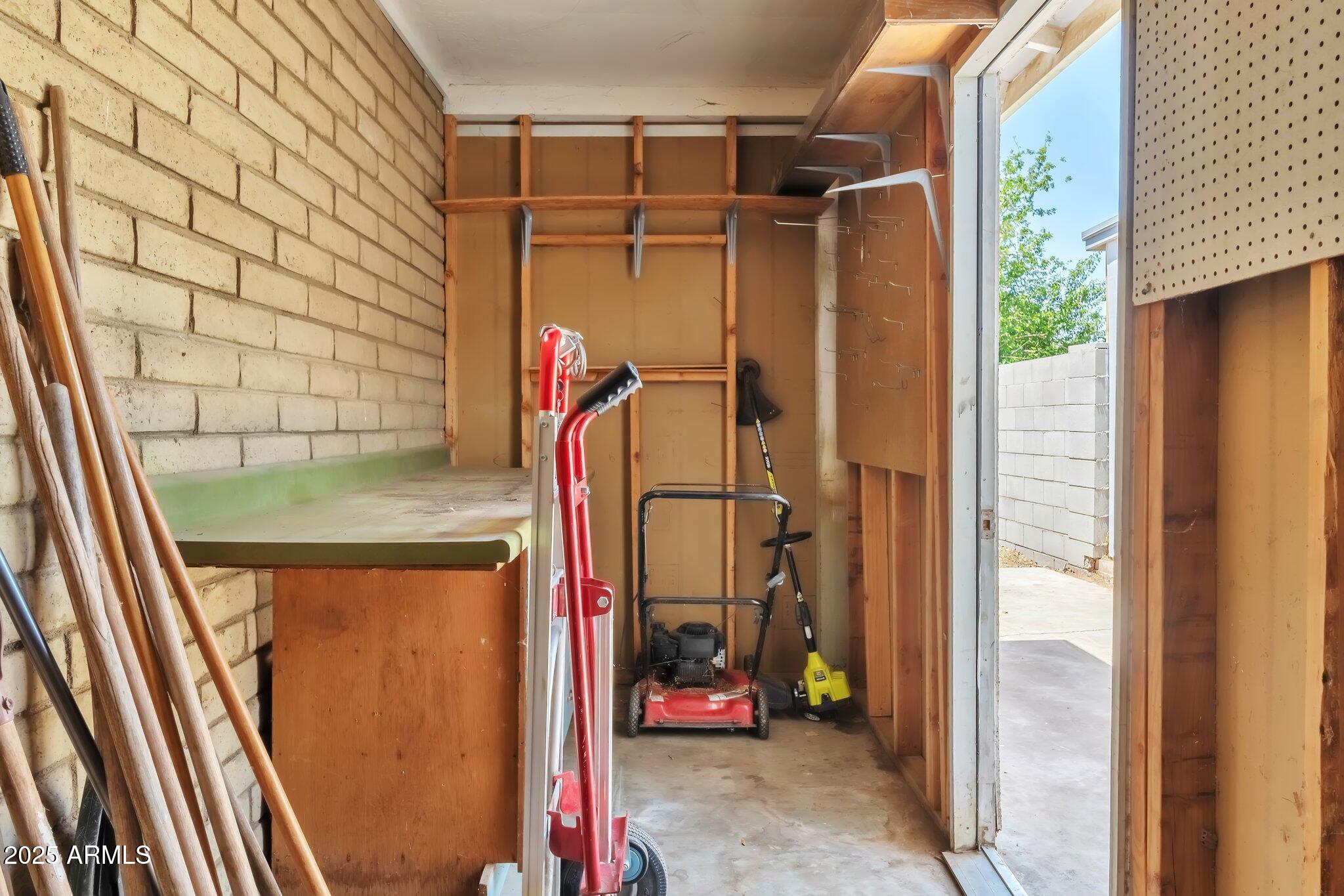 504 North Emerson Mesa, AZ 85201 - Photo 15 of 19 a view of walk in closet with clothes and shoes