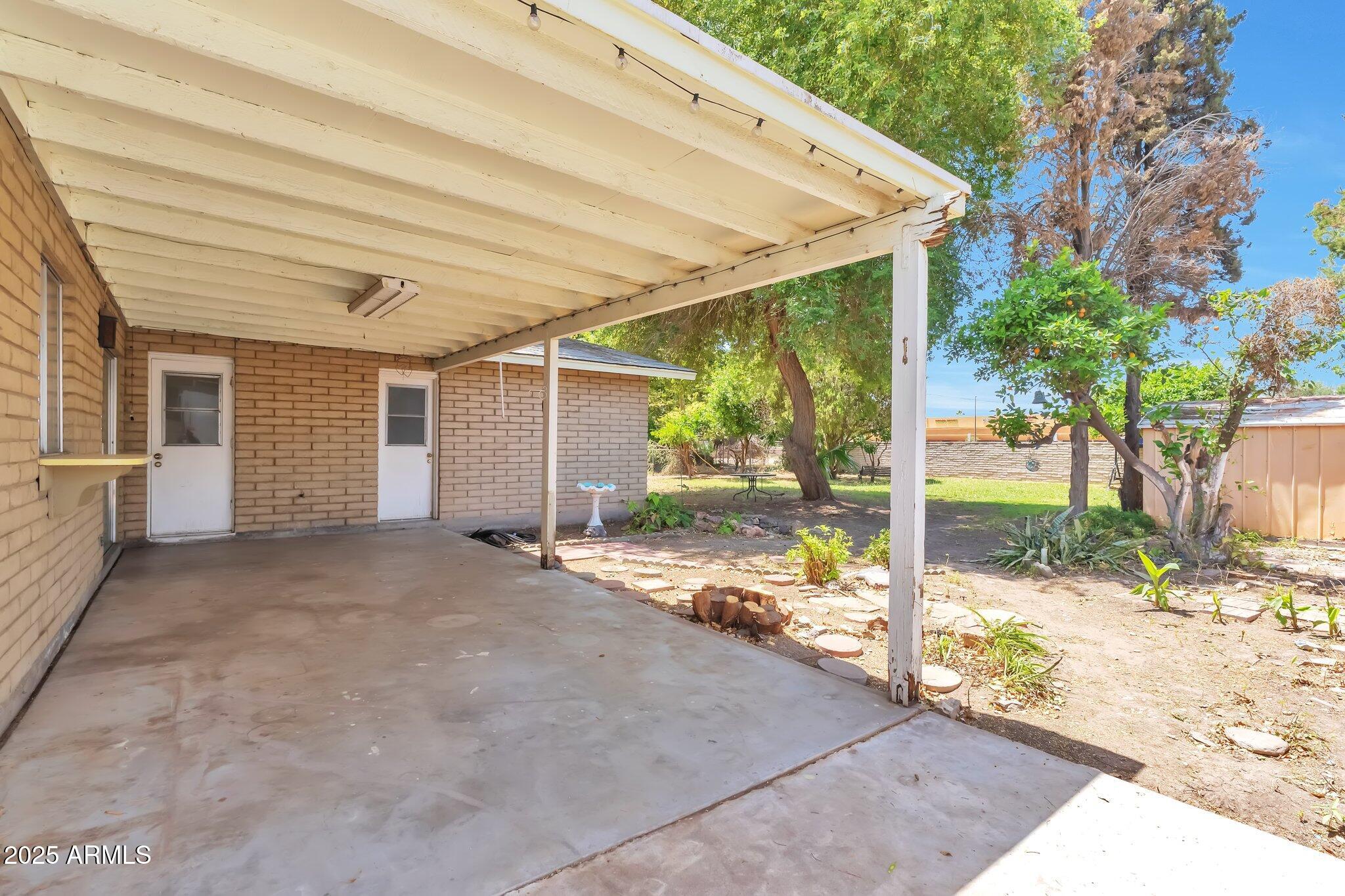 504 North Emerson Mesa, AZ 85201 - Photo 17 of 19 a view of a house with backyard and porch