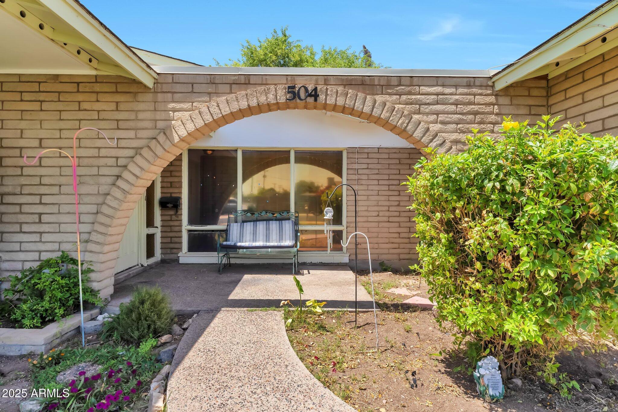 504 North Emerson Mesa, AZ 85201 - Photo 3 of 19 a front view of a house with a yard