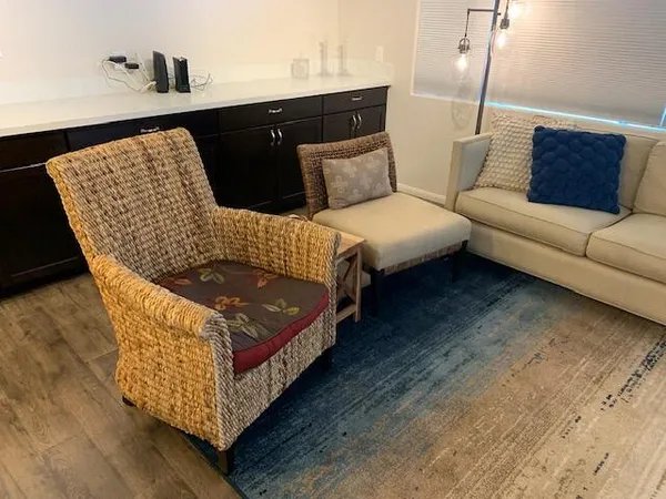a living room with a bed and furniture