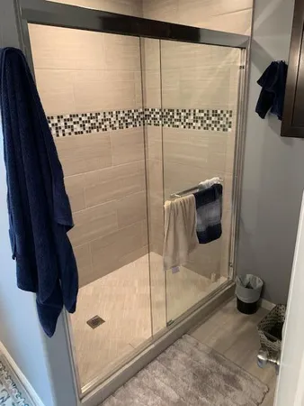 a bathroom with a tub and a shower
