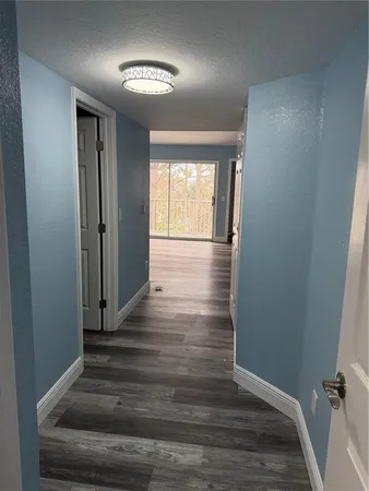 a view of entryway with wooden floor