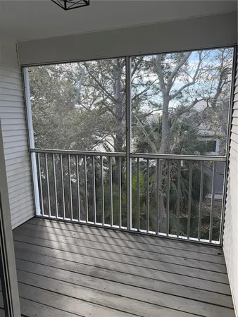 a view of a balcony with wooden floor