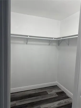 a view of an empty walk in closet