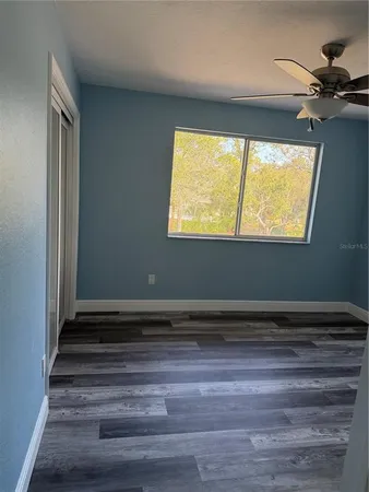 a view of room window and wooden floor