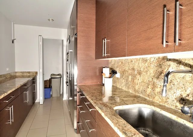 a view of a livingroom with dining room and kitchen view