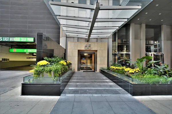 a front view of a house with outdoor seating