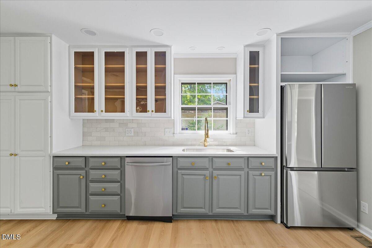1214 East Oak Drive Durham, NC 27712 - Photo 13 of 36 a kitchen with a sink window and refrigerator