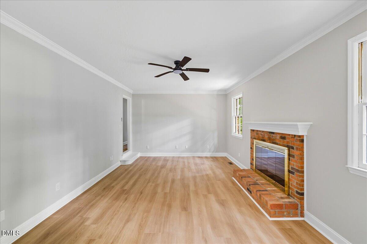 1214 East Oak Drive Durham, NC 27712 - Photo 18 of 36 wooden floor in an empty room with a window
