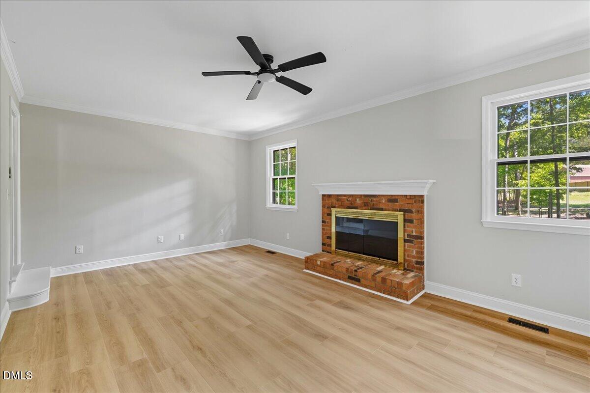 1214 East Oak Drive Durham, NC 27712 - Photo 19 of 36 a view of a livingroom with a fireplace and window