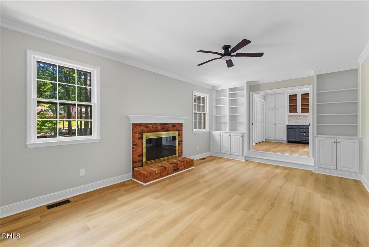 1214 East Oak Drive Durham, NC 27712 - Photo 20 of 36 a view of an empty room with a fireplace and a window