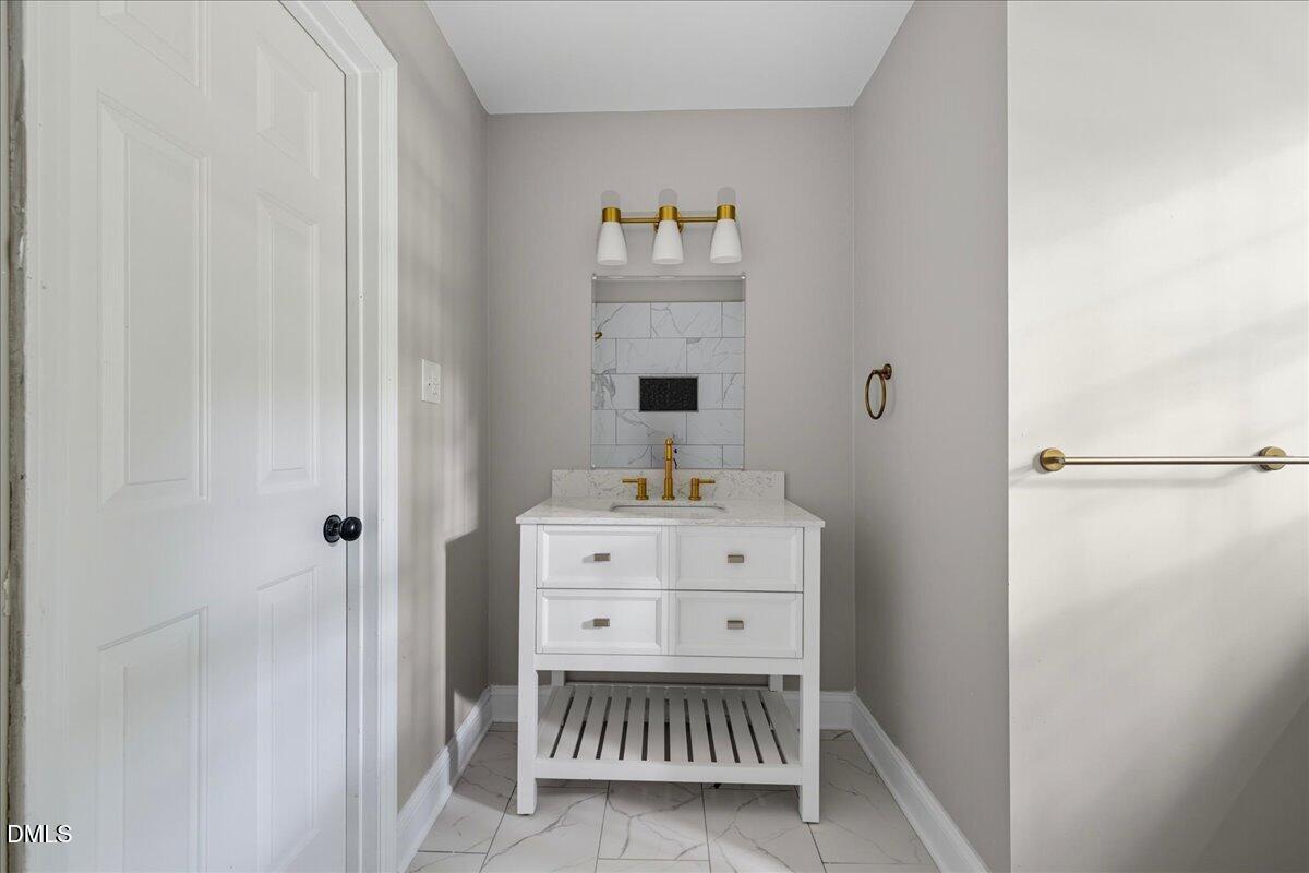 1214 East Oak Drive Durham, NC 27712 - Photo 23 of 36 a room with a baby crib and a dresser