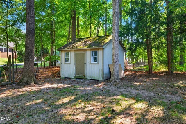 a front view of house with garden