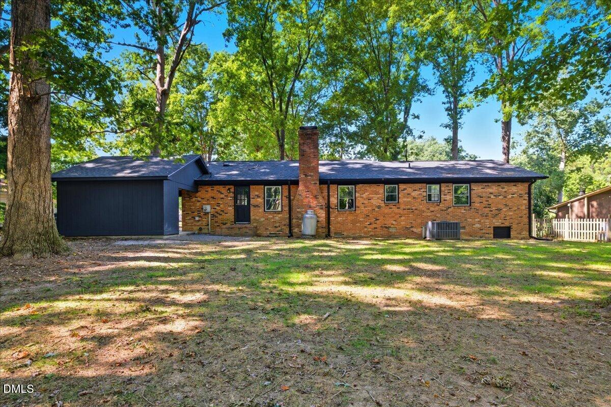 1214 East Oak Drive Durham, NC 27712 - Photo 34 of 36 a view of a house with a yard and a large tree