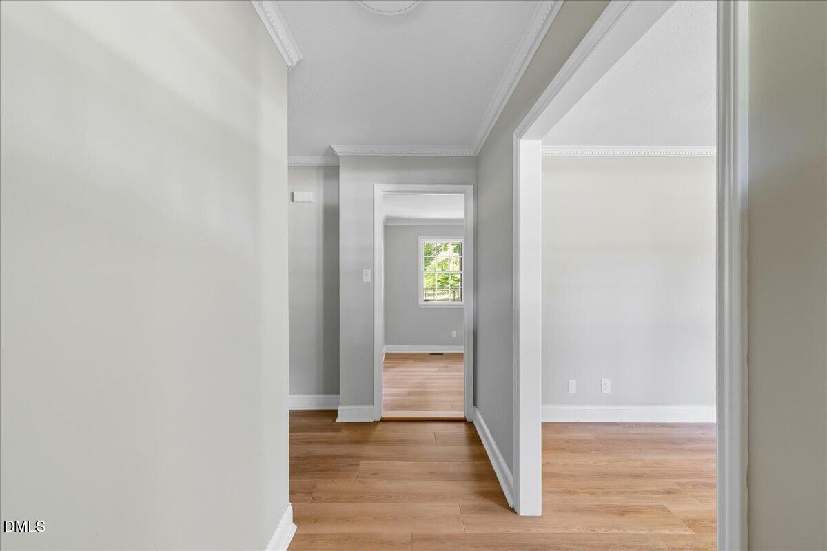 1214 East Oak Drive Durham, NC 27712 - Photo 4 of 36 a view of a hallway with wooden floor