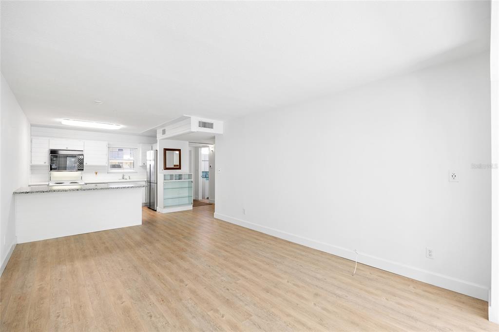 9950 47th Avenue North, Unit 104 St. Petersburg, FL 33708 - Photo 14 of 37 a view of kitchen with wooden floor