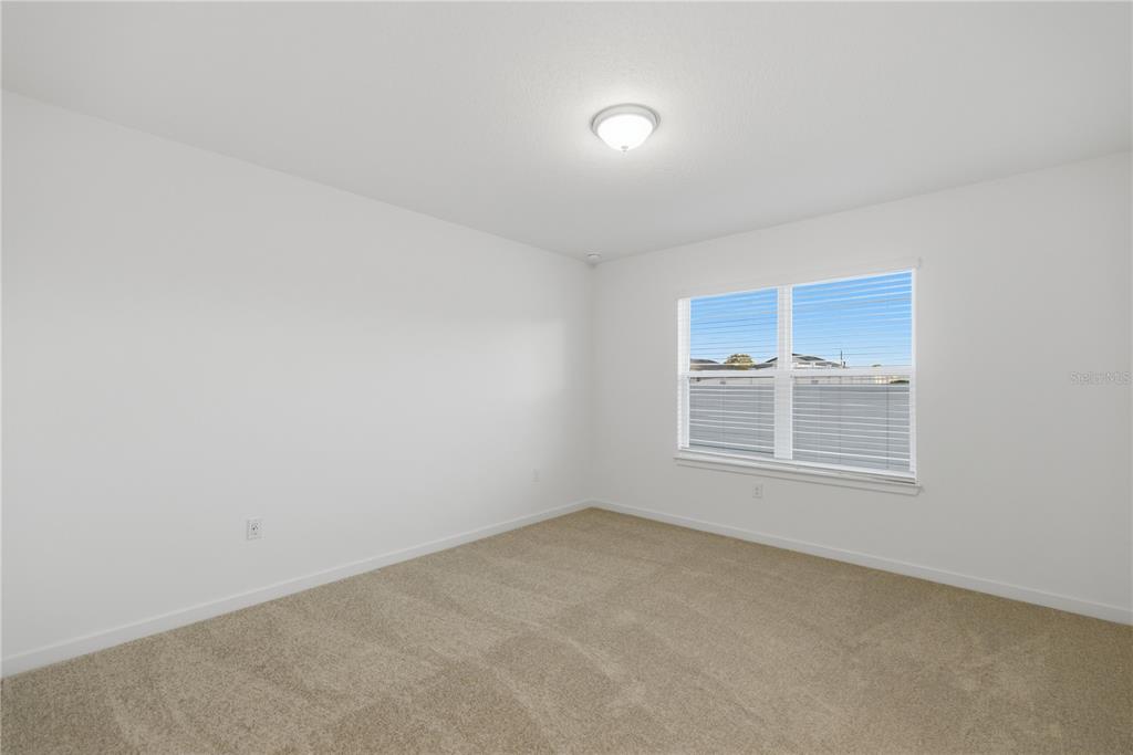 6760 Southwest 90th Loop Ocala, FL 34476 - Photo 14 of 28 an empty room with a window