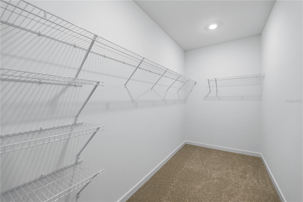 6760 Southwest 90th Loop Ocala, FL 34476 - Photo 16 of 28 a view of a room with racks on the wall