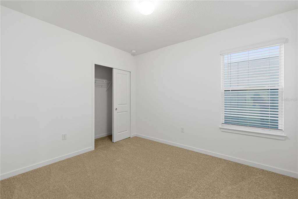 6760 Southwest 90th Loop Ocala, FL 34476 - Photo 19 of 28 an empty room with a window