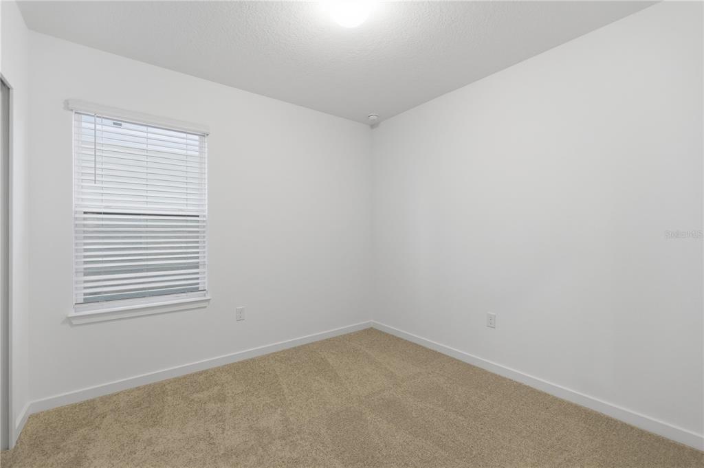 6760 Southwest 90th Loop Ocala, FL 34476 - Photo 24 of 28 an empty room with a window