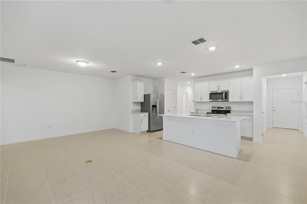 6760 Southwest 90th Loop Ocala, FL 34476 - Photo 10 of 28 a large white kitchen with stainless steel appliances