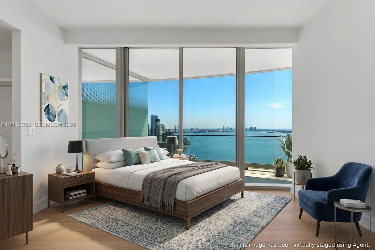 175 Southeast 25th Road, Unit 3601 Miami, FL 33129 - Photo 15 of 27 a bedroom with a bed and a window