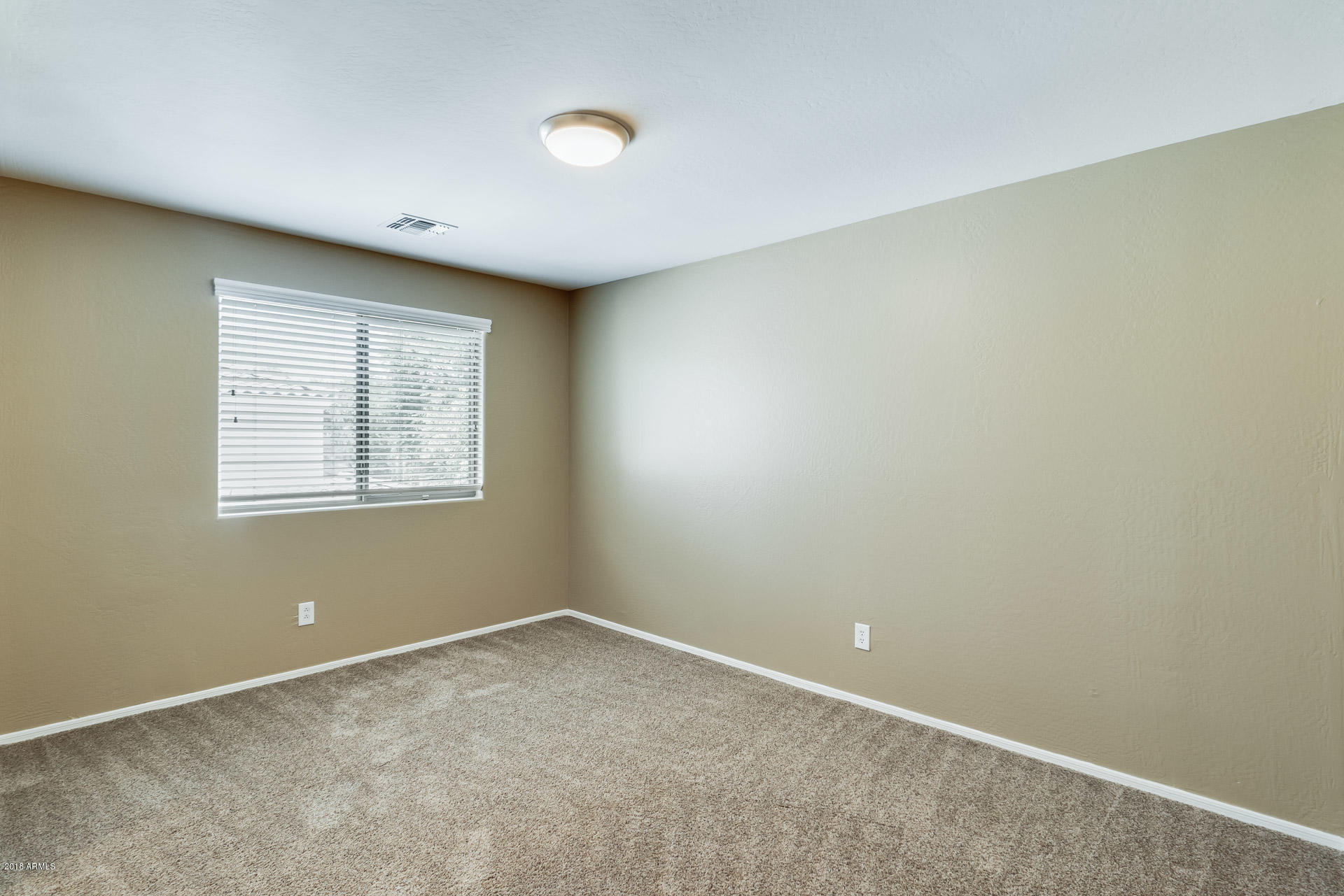3250 East Blue Ridge Way Gilbert, AZ 85298 - Photo 37 of 44 an empty room with windows