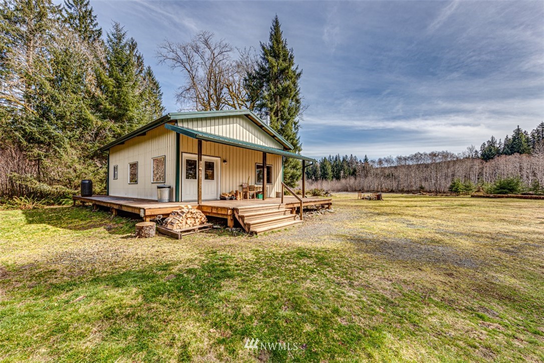 3386 Undi Road Forks, WA 98331 - Photo 2 of 36 a view of a house with swimming pool and sitting area