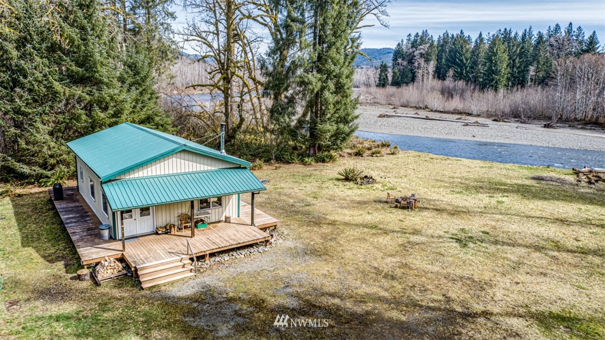 3386 Undi Road Forks, WA 98331 - Photo 13 of 36 a view of a house with backyard and sitting area