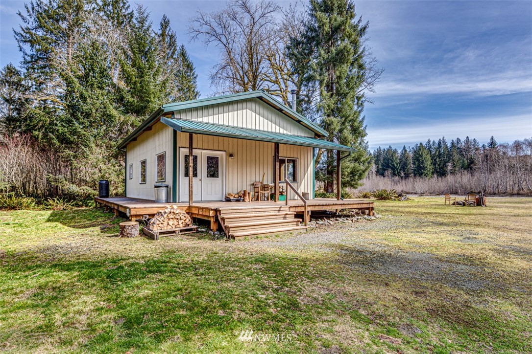 3386 Undi Road Forks, WA 98331 - Photo 3 of 36 a view of a house with swimming pool and sitting area