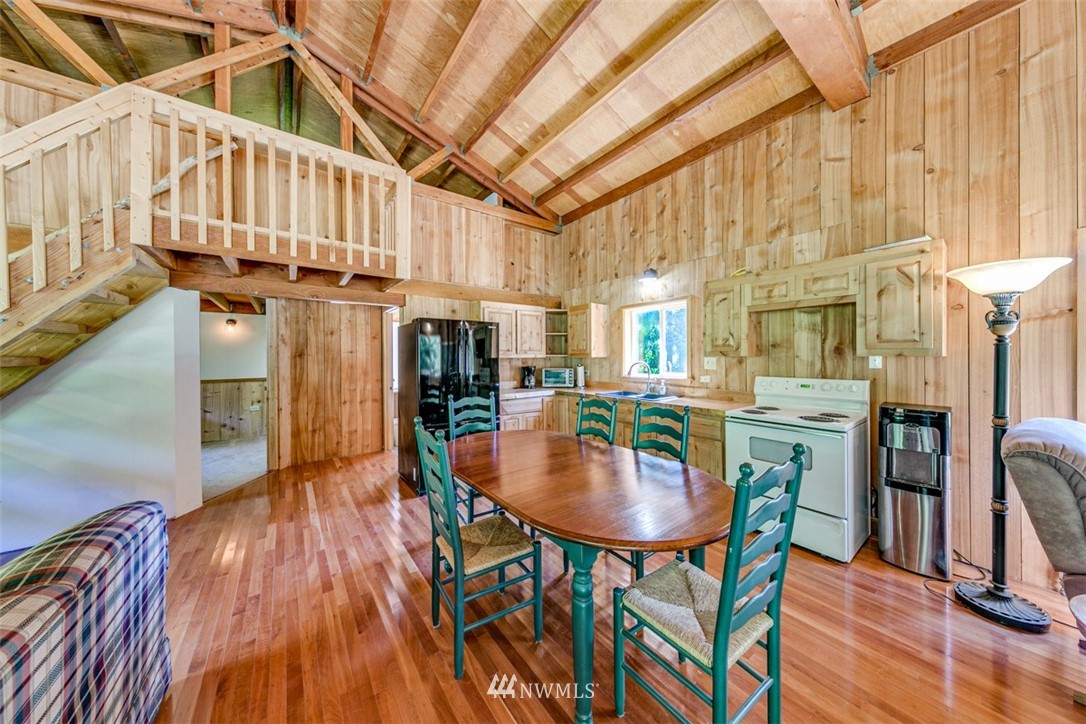 3386 Undi Road Forks, WA 98331 - Photo 22 of 36 a dining room with furniture and wooden floor