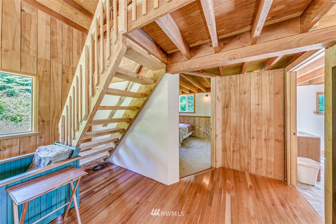 3386 Undi Road Forks, WA 98331 - Photo 27 of 36 a view of entryway with wooden floor and stairs