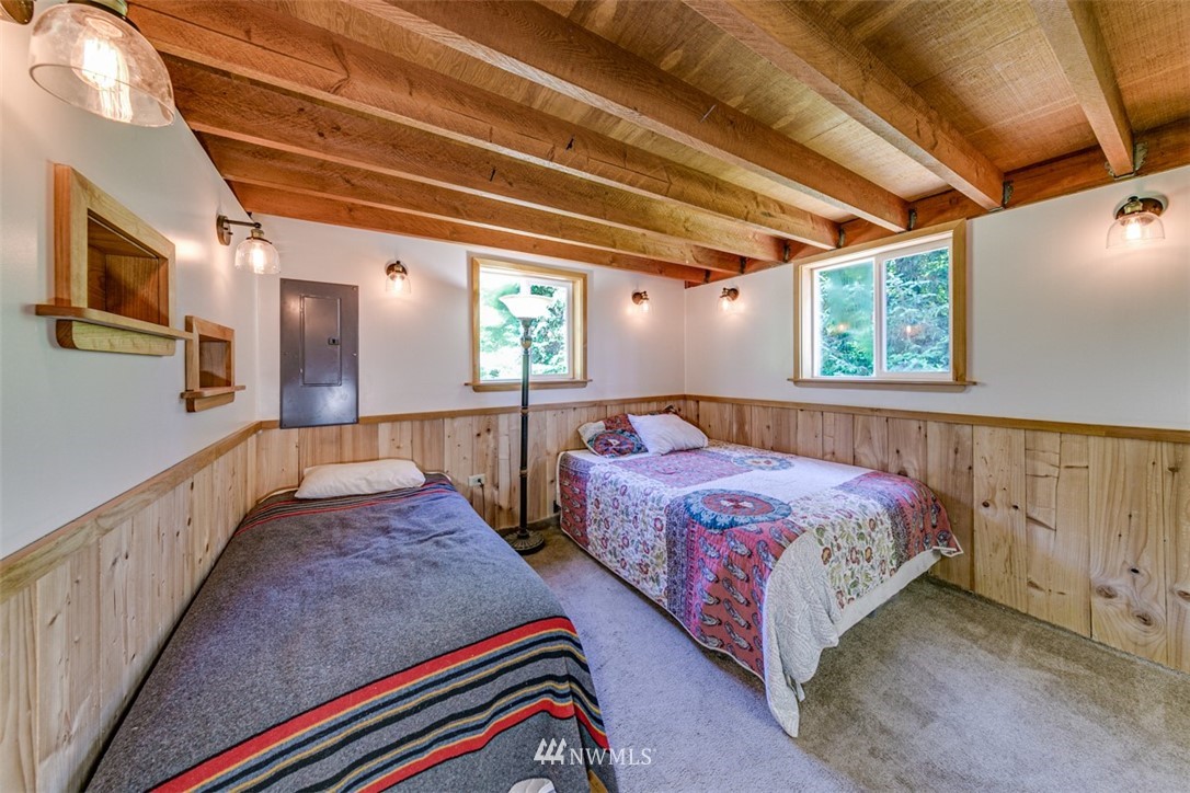 3386 Undi Road Forks, WA 98331 - Photo 28 of 36 a bed room with two beds and a large window
