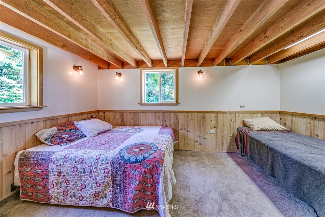 3386 Undi Road Forks, WA 98331 - Photo 29 of 36 a bedroom with a bed and wooden floor