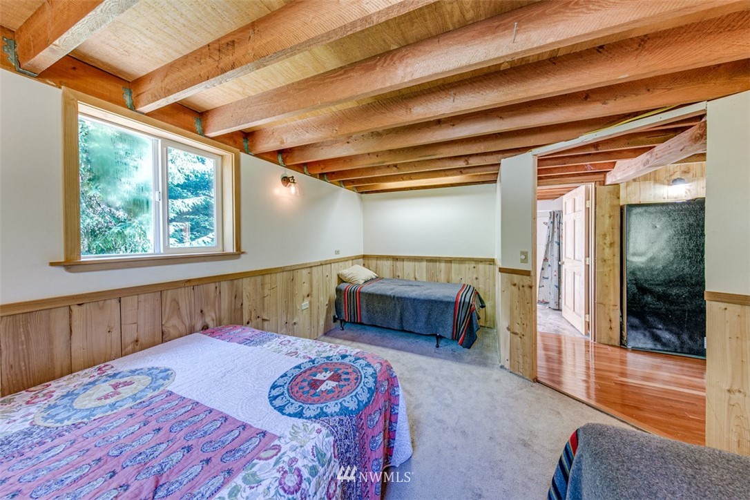 3386 Undi Road Forks, WA 98331 - Photo 30 of 36 a bedroom with a large bed and a balcony