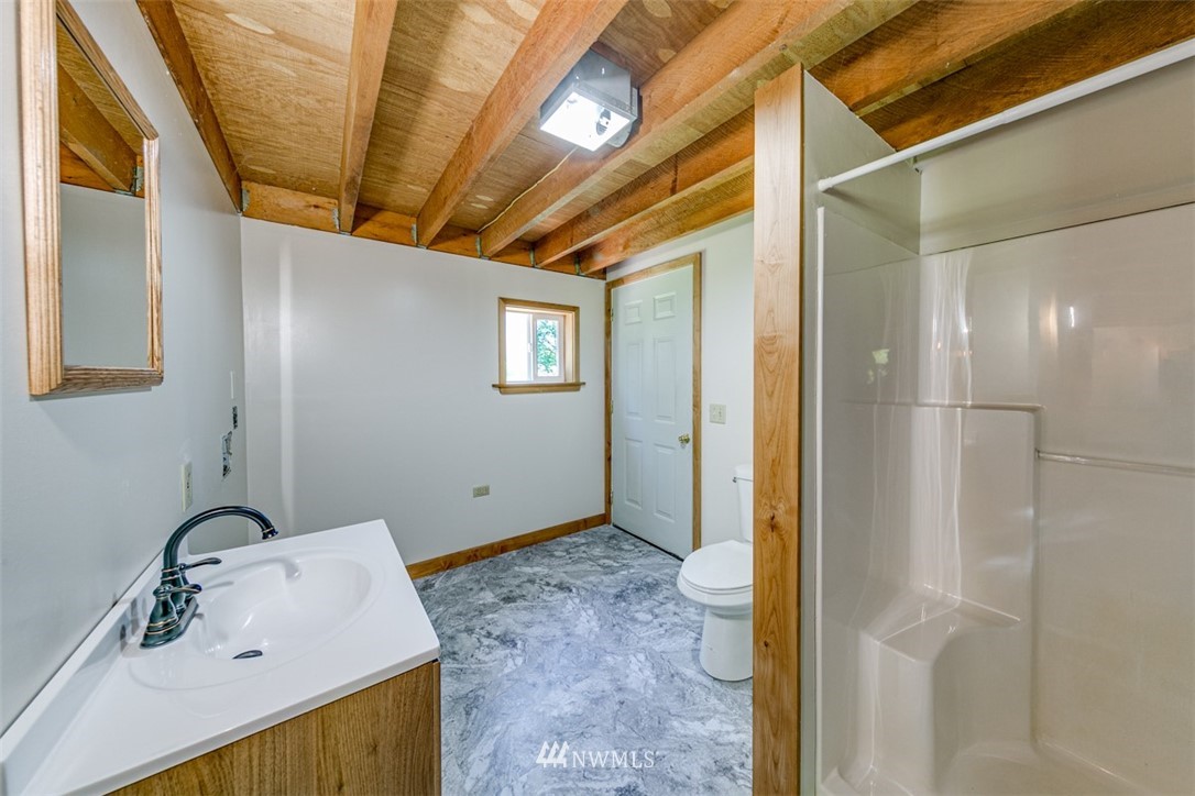 3386 Undi Road Forks, WA 98331 - Photo 31 of 36 a bathroom with a sink and a mirror