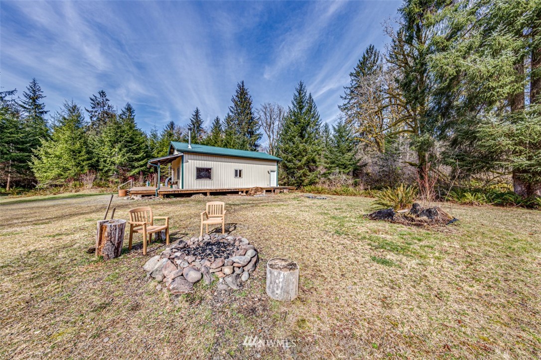 3386 Undi Road Forks, WA 98331 - Photo 10 of 36 a view of a house with backyard and trees