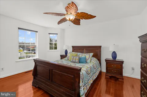 a bedroom with a bed and flat screen tv