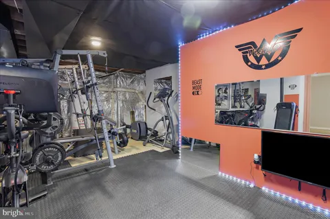 a view of a roof deck with table and chairs and wooden floor