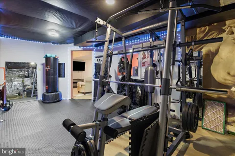 a view of a swimming pool with a lounge chair and a fire pit