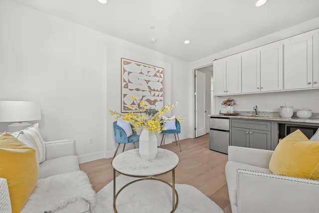 a living room with furniture and a table