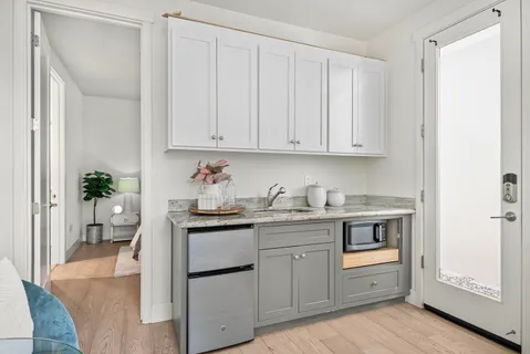 a kitchen with stainless steel appliances granite countertop a sink and cabinets