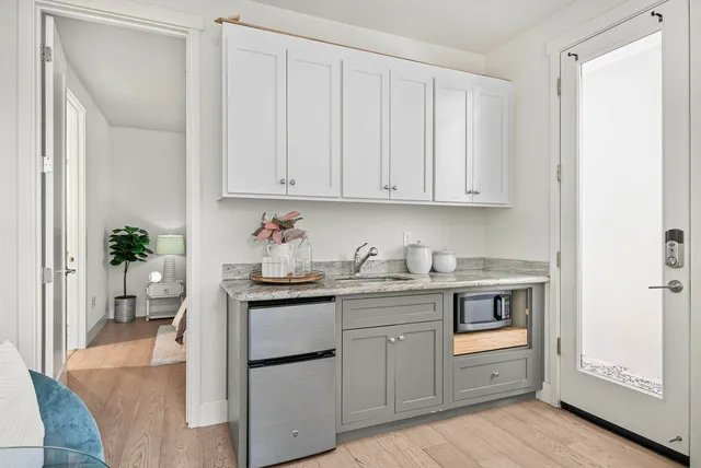 a kitchen with stainless steel appliances granite countertop a sink and cabinets