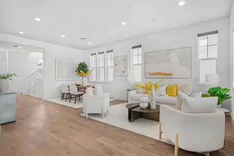 a living room with furniture and a table