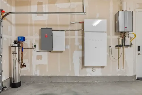 an aerial view of a house with a garden and swimming pool