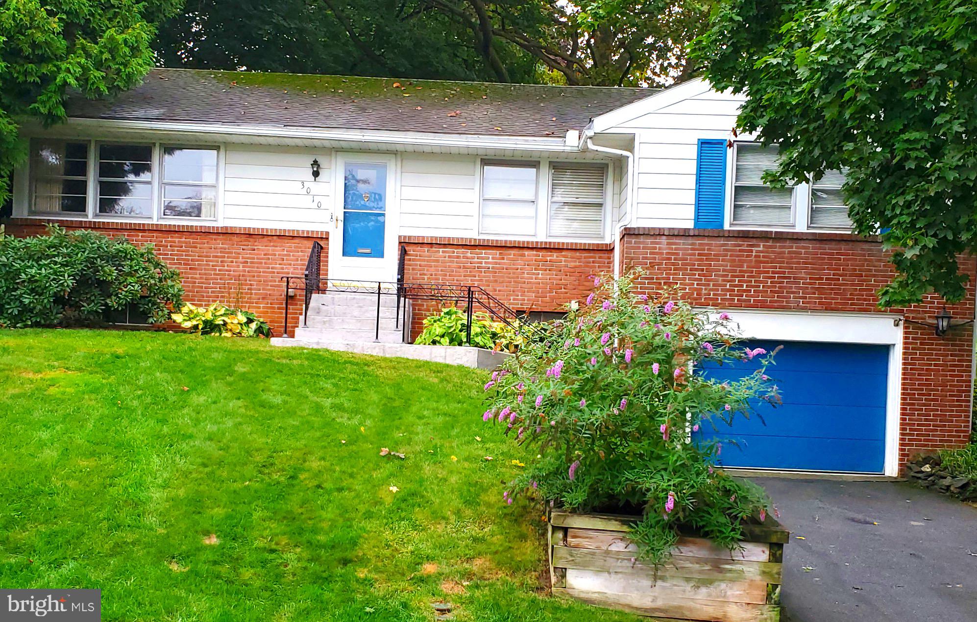 3010 Curtis Road Reading, PA 19608 - Photo 1 of 14 front view of house with a yard